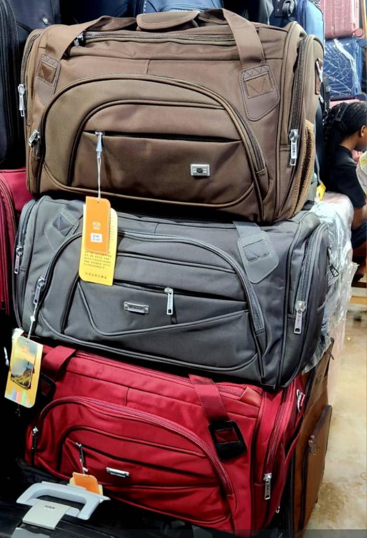 Travel duffel bags brown grey red on white background