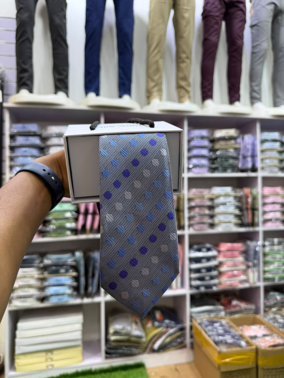 Silver herringbone tie with blue polka dots