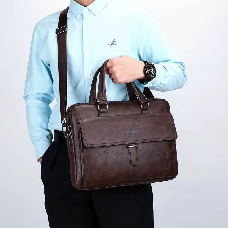 Jeep Buluo dark brown leather briefcase bag - lifestyle shot worn by man in blue shirt