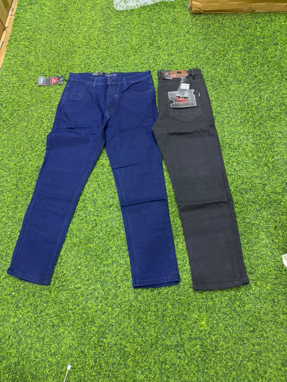 Two V9 Star Jeans in navy blue and charcoal black shown full length