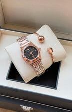 Original black dial watch and rose gold bracelet set displayed in box