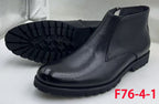 Black textured ankle boots with zip closure and chunky treaded soles