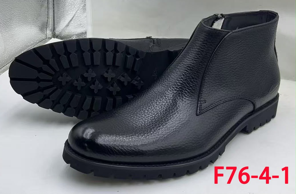 Black textured ankle boots with zip closure and chunky treaded soles