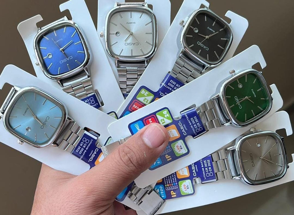 Six square-dial watches with silver-tone bracelets in blue, white, black, green, light blue and grey
