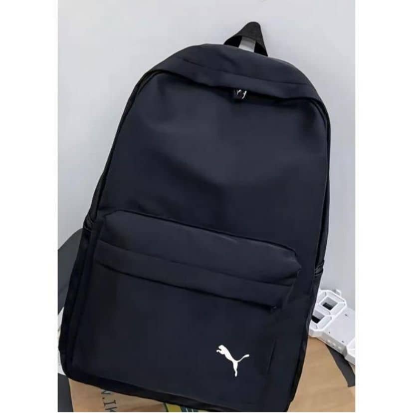 Black backpack with front pocket and white cat logo