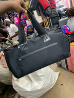 Original photo of black travel duffle bag with long handles and front zip pocket