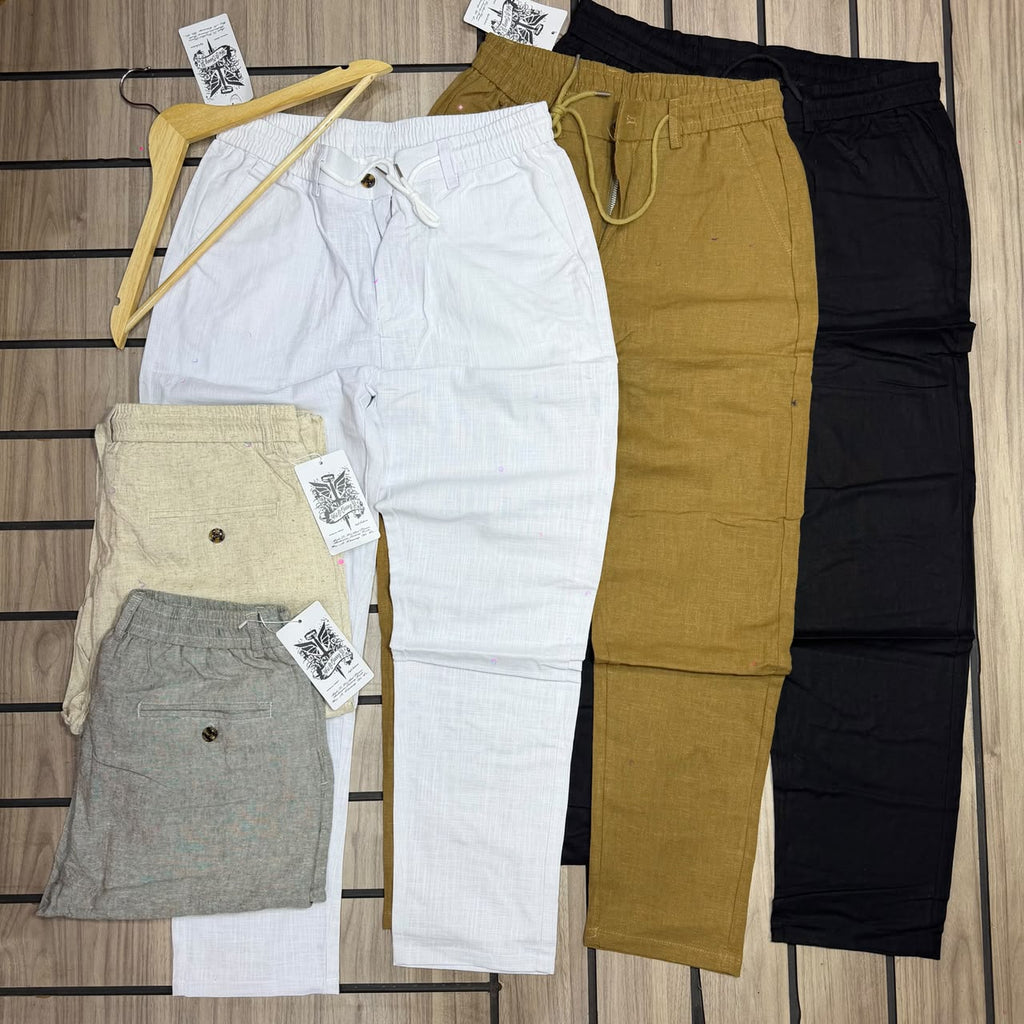 Original photo of white, mustard, black, beige and grey drawstring trousers