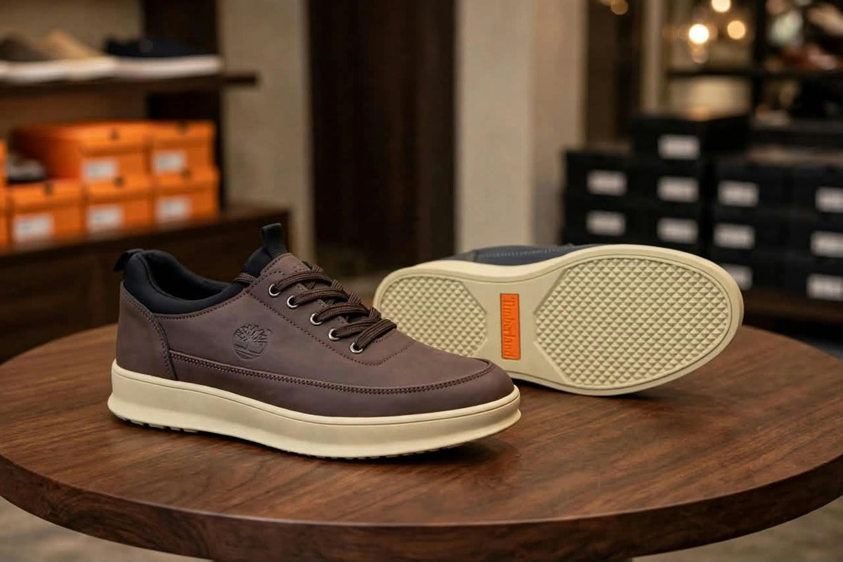 Original brown lace-up sneakers showing cream outsole with orange accent
