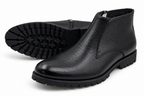 Black ankle boots on a white background