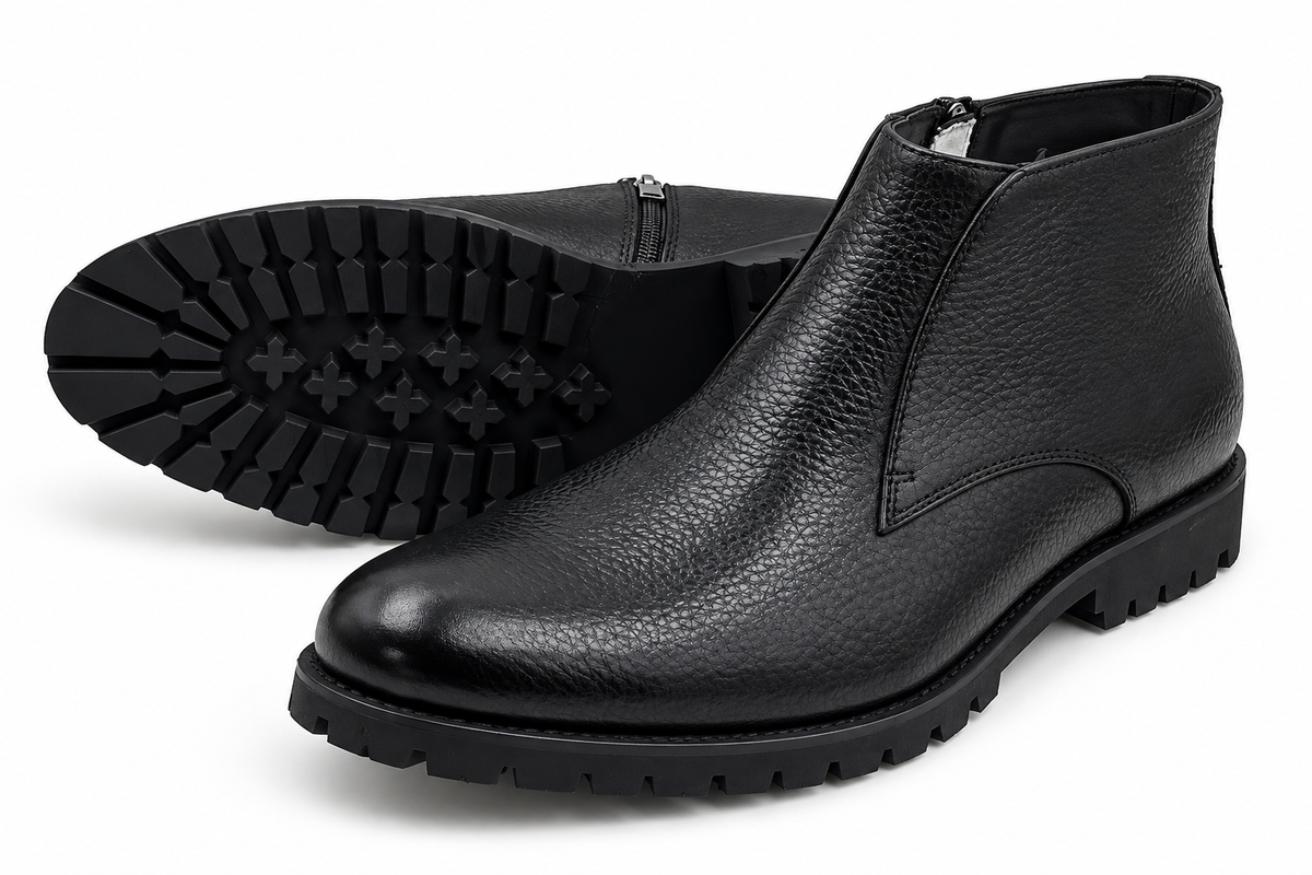 Black ankle boots on a white background