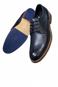 Black lace-up shoes with a white-background edit