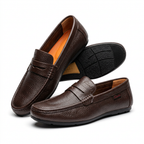 Brown textured penny loafers on white background