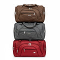 Travel duffel bags in brown grey and red stacked