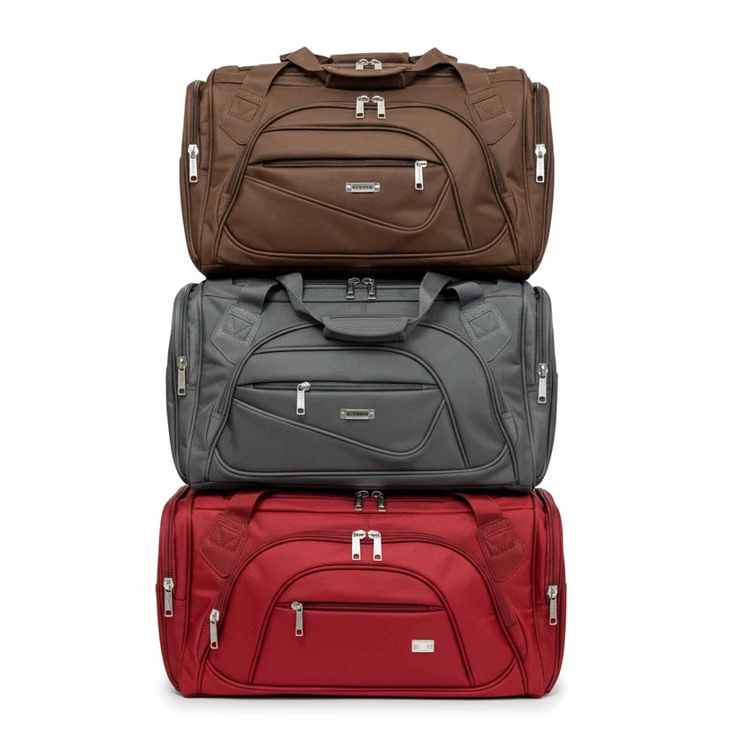 Travel duffel bags in brown grey and red stacked