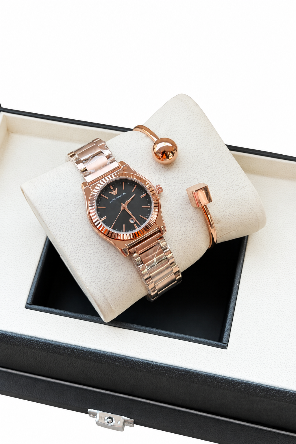 Black dial watch and rose gold bracelets in presentation box on white background