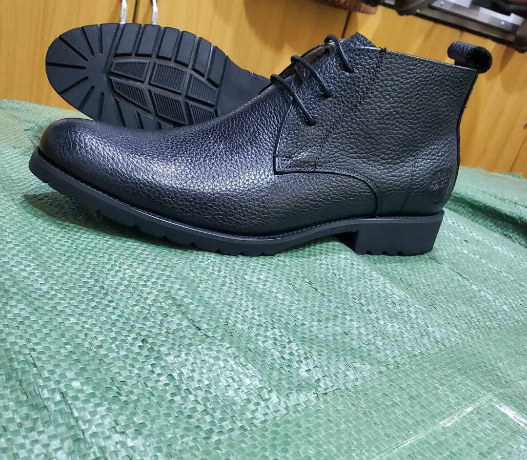 Original photo of black textured lace-up ankle boots