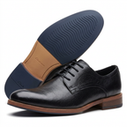 Black plain-toe gentle shoes with brown welt on white background