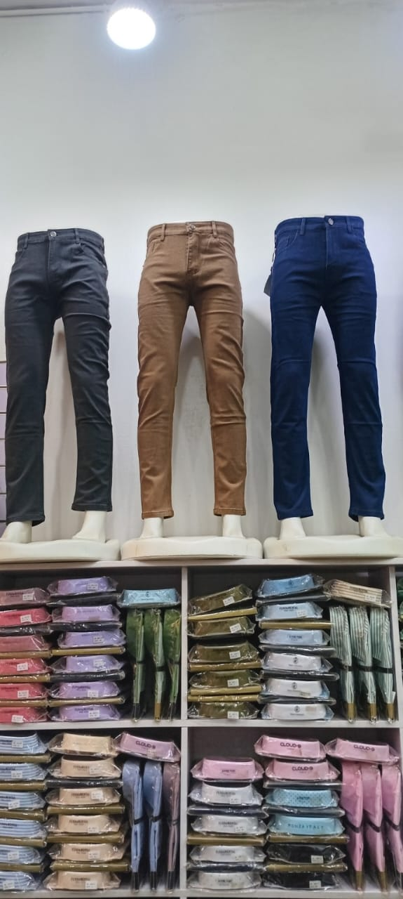 Black, brown, and navy V9 Star Jeans displayed full length