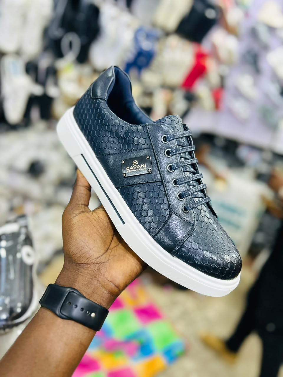 Original photo of dark scale-texture lace-up sneaker