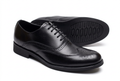 Classic black wingtip brogue gentle shoes on white background