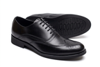 Classic black wingtip brogue gentle shoes on white background
