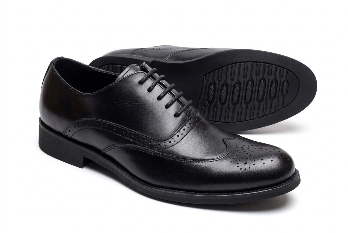 Classic black wingtip brogue gentle shoes on white background