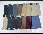 Original photo of fourteen assorted men's khaki trousers