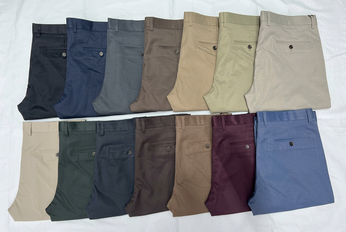 Fourteen assorted men's khaki trousers with labels and number overlays removed