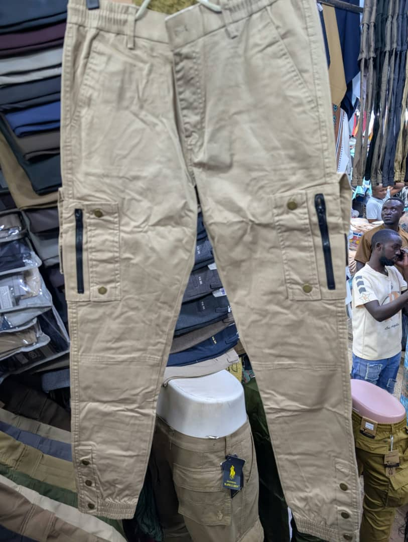 Men's sand cargo pants with zippered pockets and snap buttons