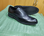 Original photo of classic black wingtip brogue shoes