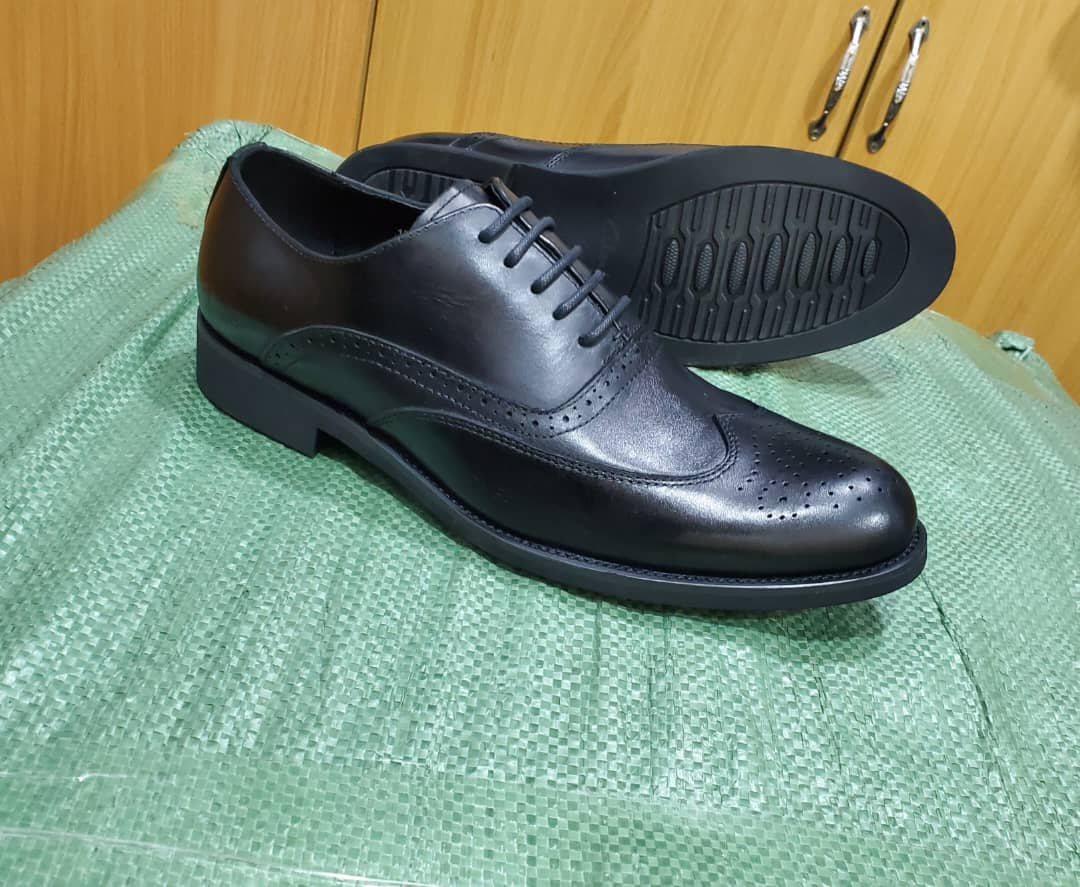 Original photo of classic black wingtip brogue shoes