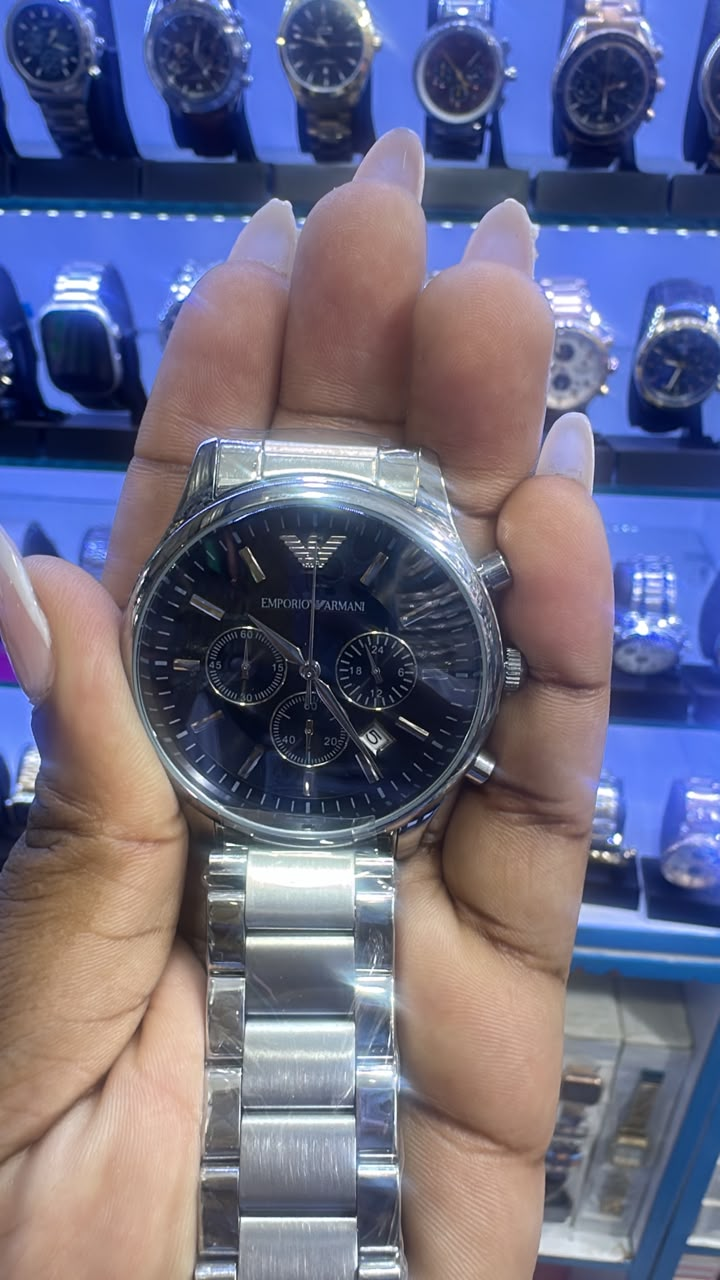 Original photo of silver-tone black-dial bracelet watch