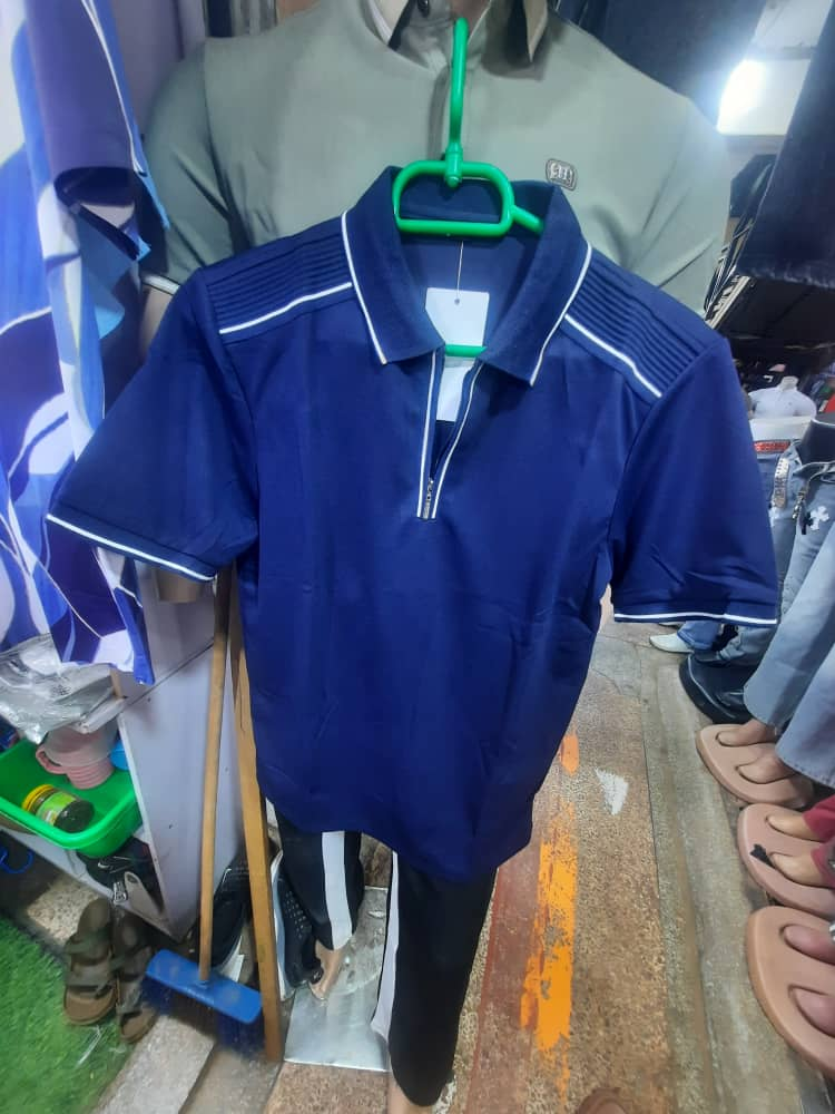 Original photo of navy zip-neck polo shirt with white piping