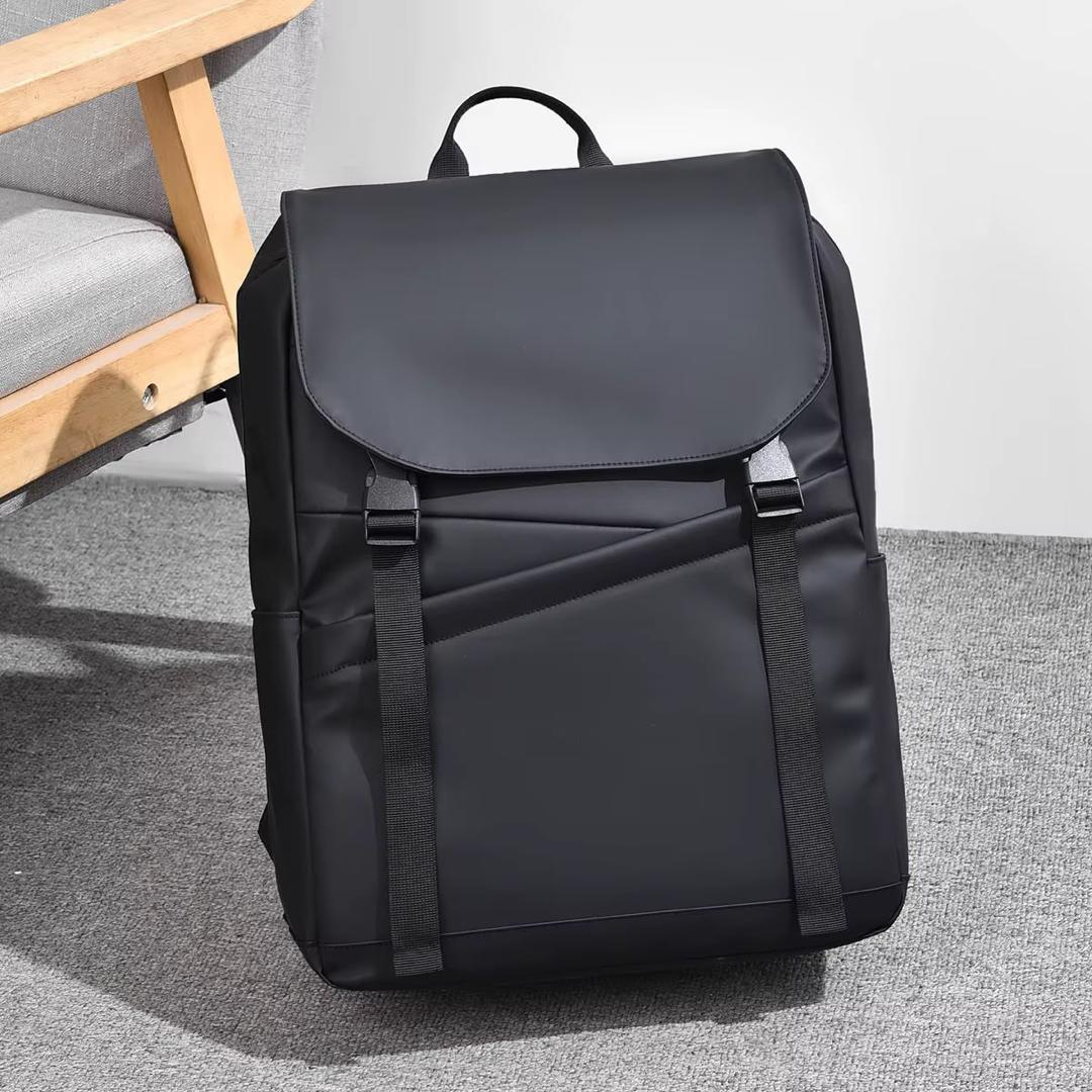 Original photo of black flap-top backpack with twin buckle straps