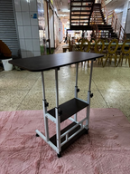 Adjustable dark laptop desk with wheels - original photo