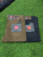 Brown and black V9 Star Jeans folded