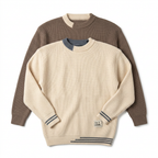 Cream and taupe textured crew-neck knit sweaters on white