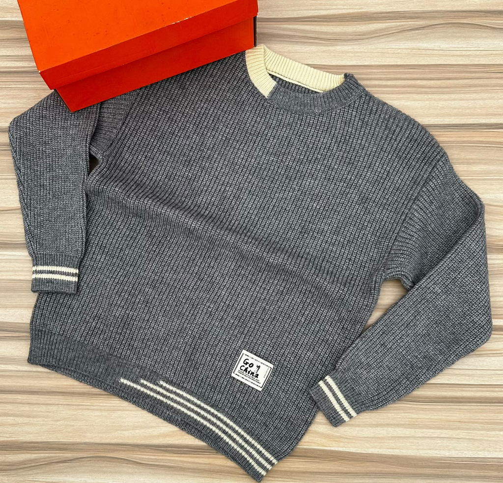 Original photo of grey textured sweater with cream striped trims