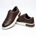 Brown textured lace-up sneakers on a white background