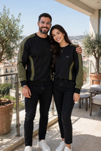 Couple wearing matching black and olive sweatshirts