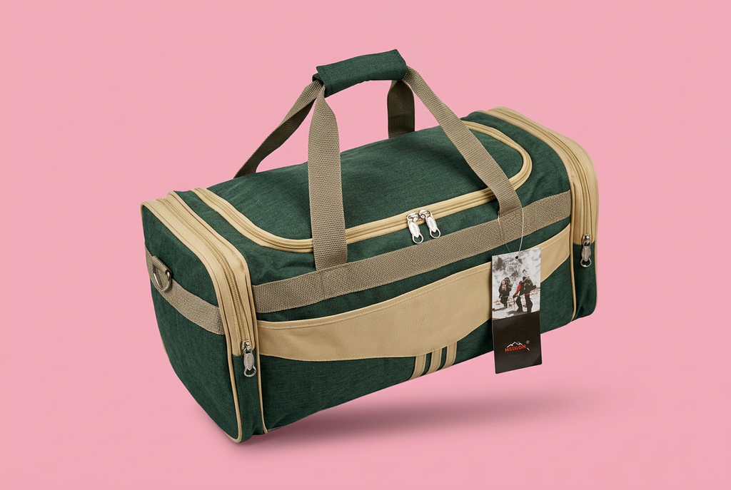 Elevated view of green and beige travel duffel bag on soft pink background