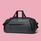 Black duffle bag detail on soft pink background