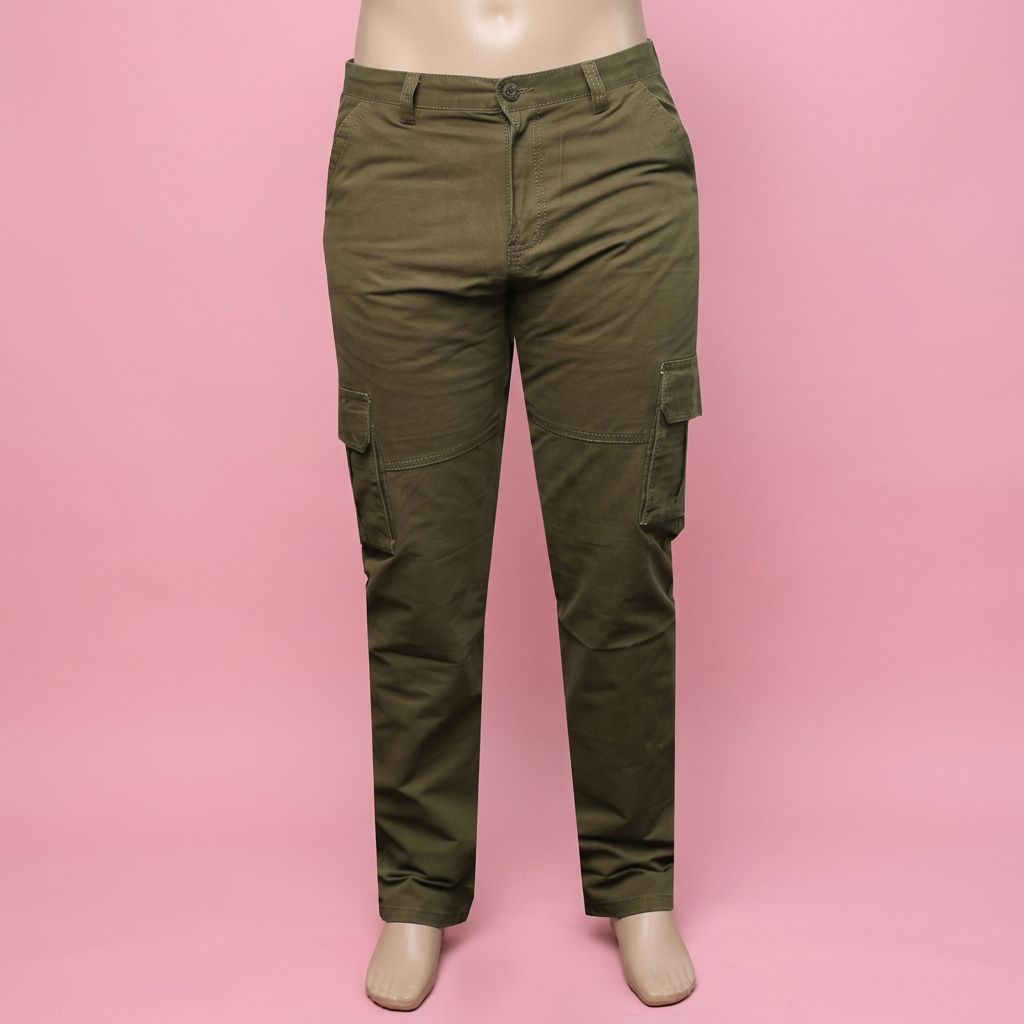 Olive green cargo pants on a mannequin against a soft pink background