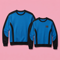 Matching blue and black sweatshirt pair on soft pink background