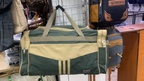 Original photo of green and beige travel duffel bag