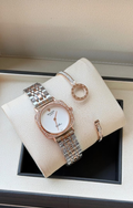White dial watch with silver metal strap and two bracelets in presentation box