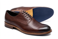 Textured brown lace-up gentle shoes on a white background