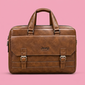 Brown double-buckle executive briefcase bag on soft pink background in square format