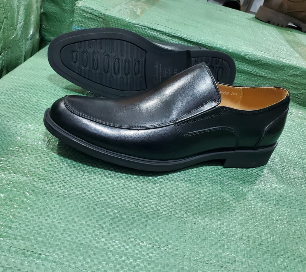 Original photograph of men's black slip-on gentle shoes