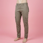 Taupe cargo pants on a mannequin against a soft pink background